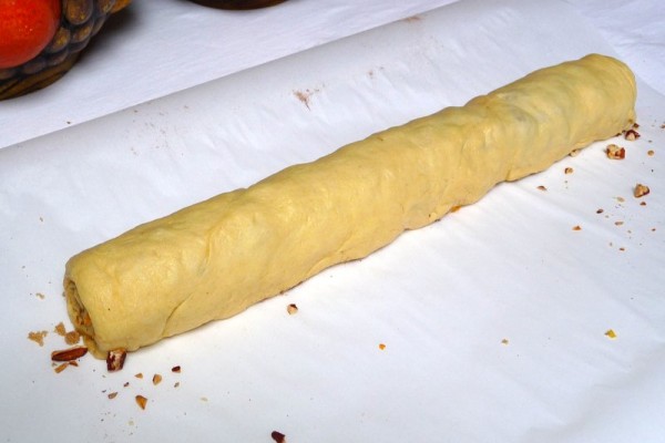 Crescent roll dough filled and ready for slicing