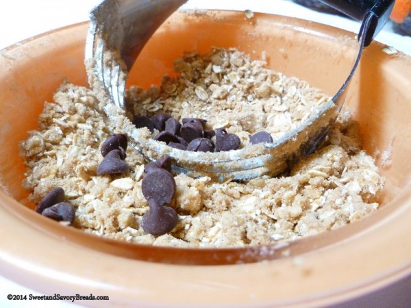 Cutting in butter and adding chocolate chips to Zucchini Bread with Chocolate Chips