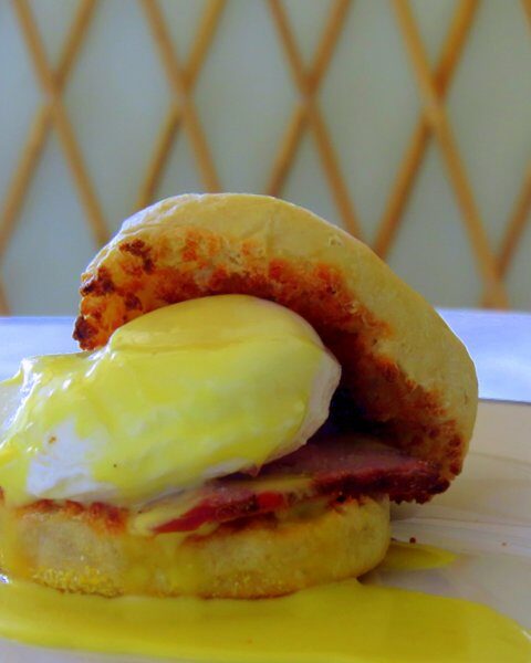 English Muffin Breakfast Sandwich with a poached egg tri-tip and hollandaise.